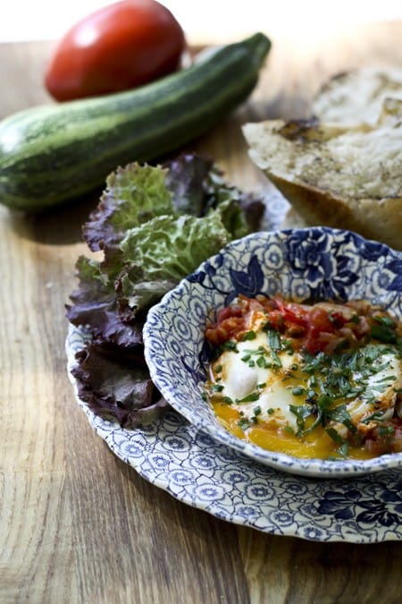 Make a fast, flavourful, garden-fresh, garlicky tomato sauce and then poach eggs directly in the sauce for a classic Shakshuka. It is traditionally served with bread for sopping up the sauce, but is equally good over cooked rice, noodles, or quinoa. The sauce can be doubled, tripled, or quadrupled and frozen in individual meal-sized portions for a taste of summer in the colder months!