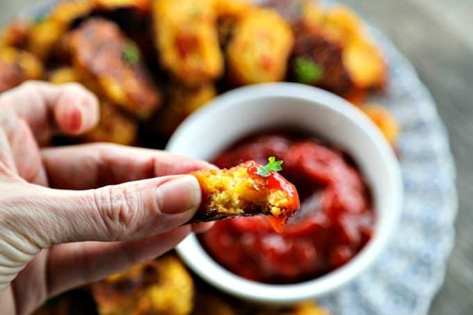 Baked, crispy, Bacon Cheddar Cauliflower Tots {Healthier Tater Tots} are the ultimate in crispy, cheesy perfection. You'd never know they're lower carb than tater tots and honestly, you'd be hard pressed to know they're NOT tater tots. 