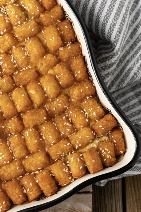 Big Mac Casserole: Saucy ground beef that tastes just like a Big Mac topped with melty cheese and tater tots then baked to bubbly, crispy tater tots topped perfection. This delicious meal the whole family will love is served with your favorite burger toppings like fistfuls of shredded lettuce, diced onion and dill pickle, and drizzled with "special sauce" or thousand island dressing. And while this twist on classic comfort food might sound weird, it is a great family dinner.