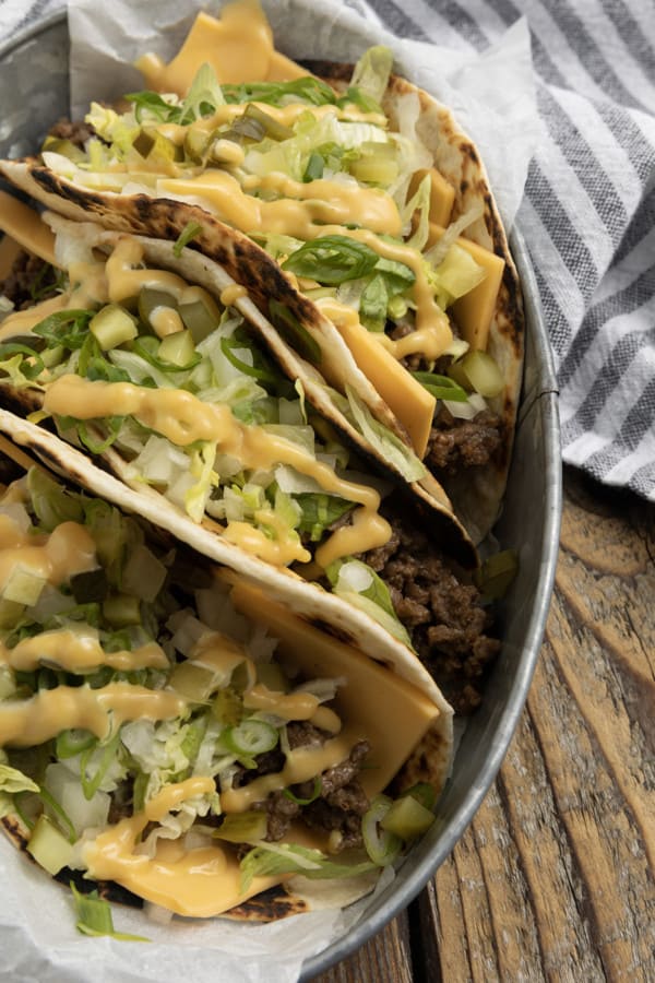 Big Mac Tacos: bringing “the golden arches” to taco night with irresistible tacos filled with seasoned beef, special sauce, lettuce, cheese, pickles, and onions on a sesame seed… tortilla. It’s everything you love about Big Macs in taco form and you don’t even have to leave the house to indulge!