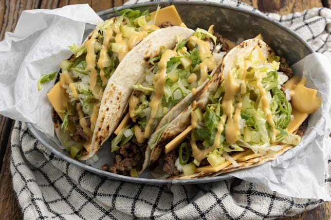 Big Mac Tacos: bringing “the golden arches” to taco night with irresistible tacos filled with seasoned beef, special sauce, lettuce, cheese, pickles, and onions on a sesame seed… tortilla. It’s everything you love about Big Macs in taco form and you don’t even have to leave the house to indulge!