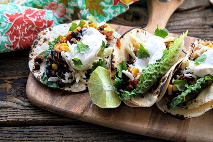 Fast, delicious, fresh, and health and budget friendly, it just doesn't get any better than these Black Bean Tacos. Salsa and chili powder provide massive flavour in this 10 minute meal will fill you up, make you happy, and keep you healthy all at the same time! This is a perfect addition to game day parties and festivities.