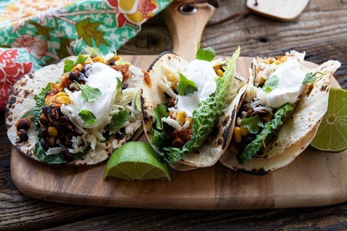 Fast, delicious, fresh, and health and budget friendly, it just doesn't get any better than these Black Bean Tacos. Salsa and chili powder provide massive flavour in this 10 minute meal will fill you up, make you happy, and keep you healthy all at the same time! This is a perfect addition to game day parties and festivities.