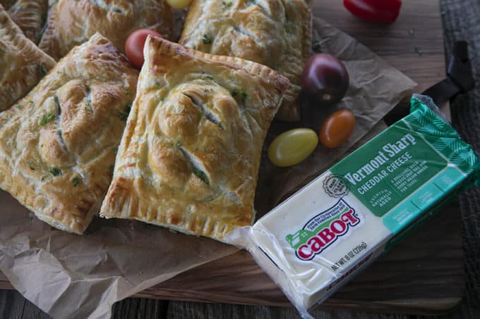 Breakfast Hot Pockets: puff pastry filled with cheesy scrambled eggs and sausage links.