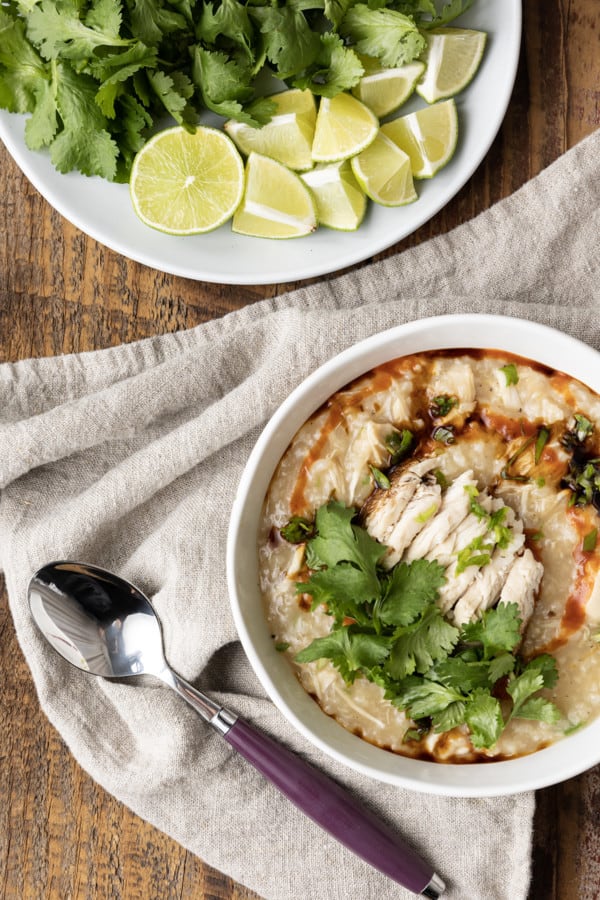 Chao Ga is a savoury, silky, thick, comforting, and filling Vietnamese chicken and rice soup or porridge that is as easy to make as it is budget friendly! Whether you serve this chicken congee for breakfast, lunch, or dinner, you’re going to love the fresh, vibrant Vietnamese flavours in this fast, fabulous, delicious dish. For an aromatic dish that bursts with flavour, this recipe is shockingly easy to prepare. And while it will undoubtedly fill you up, it’ll do so for pennies and won’t leave you feeling weighed down.