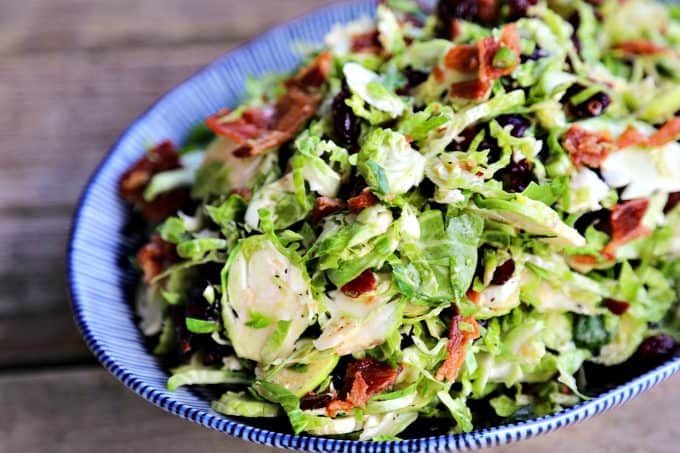 Cranberry Brussels Salad with Bacon Vinaigrette: crisp-tender Brussels sprouts with tart, sweet dried cranberries and a warm bacon, green onion vinaigrette.