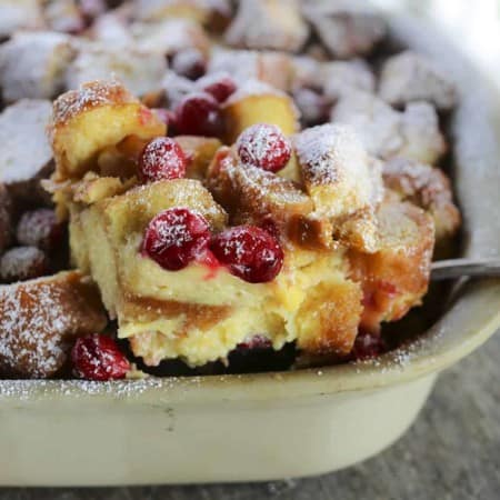 Rich, souffle-like, nutmeg flecked Cranberry Eggnog Doughnut Bread Pudding is the ultimate cold weather dessert.