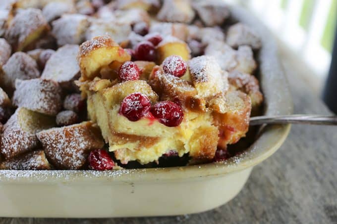 Rich, souffle-like, nutmeg flecked Cranberry Eggnog Doughnut Bread Pudding is the ultimate cold weather dessert.