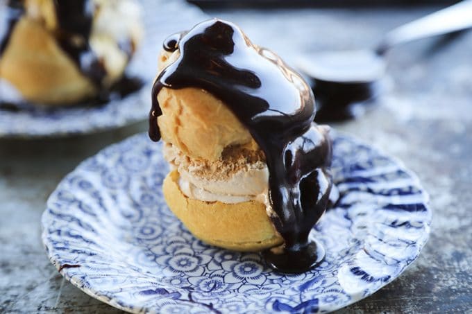 Homemade Cream Puffs filled with ice cream and topped with hot fudge sauce for profiteroles.