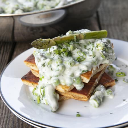 Tender spring peas and asparagus combine in a garden herb cream sauce in this new-fashioned take on delightfully old-fashioned Creamed Peas. Served over toast, this is one simple, economical dish wows!