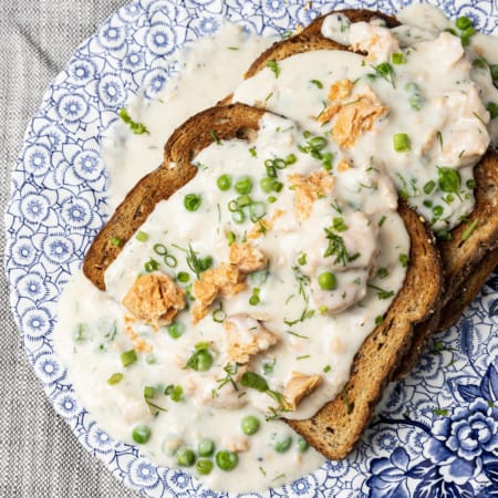 This comforting, delicious creamed salmon recipe is unapologetically old-fashioned. Served over your favourite toast, rice, or hot egg noodles, you can’t beat this ultra-fast meal option for breakfast, lunch, or dinner. This is an ultra budget friendly version of classic salmon in cream sauce. You can make it as written or make it your own by getting creative! The recipe includes some delicious variations on the theme and ideas for substituting ingredients.