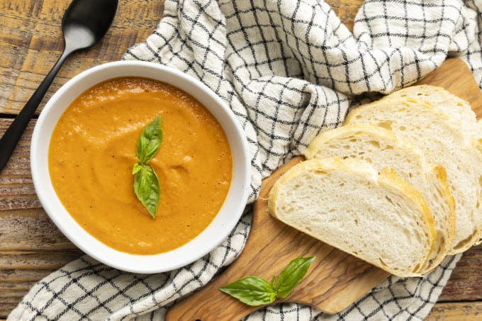 Super smooth, ultra Creamy Tomato Basil Soup is both the best and easiest way to make soup from fresh tomatoes. You’re going to love this so much, you’ll want to double, triple or even quadruple the recipe to keep on hand in the freezer long after summer and fresh tomatoes are a pleasant memory.