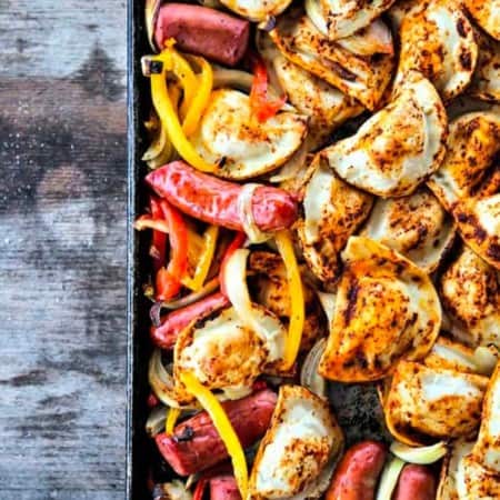 Kielbasa and Pierogies Sheet Pan Meal with juicy roasted kielbasa, crisp tender peppers and onions and puffy, potato filled pierogies.