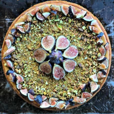 Ultra-creamy, not too sweet, and a feast-for-the-eyes while still being simple to make, this vanilla bean flecked Fig Pistachio Honey Goat Cheese Cheesecake is a show stopper!