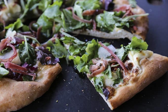 Figgy Pig Pizza - Tuscan Style Prosciutto, fig jam, and greens pizza from foodiewithfamily.com #client #DaVinciStorytellerFiggy Pig Pizza - Tuscan Style Prosciutto, fig jam, and greens pizza from foodiewithfamily.com #client #DaVinciStoryteller