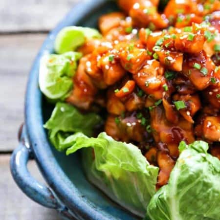 Honey Sriracha Glazed Salmon Bites: Tender salmon tossed in a sticky, sweet, spicy mahogany sauce. Serve in lettuce wraps, or on hot rice.