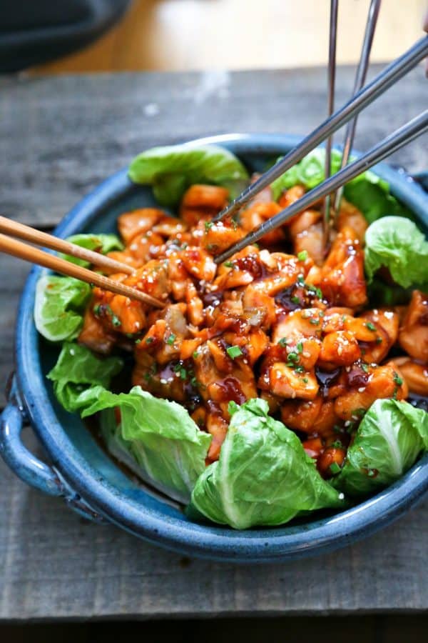 Honey Sriracha Glazed Salmon Bites: Tender salmon tossed in a sticky, sweet, spicy mahogany sauce. Serve in lettuce wraps, or on hot rice.