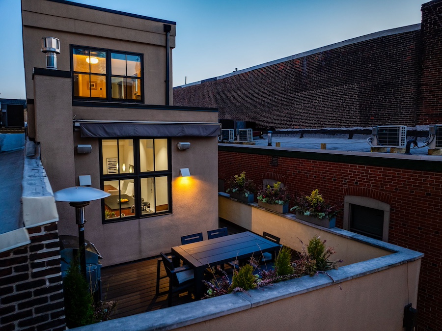 roof deck and fourth-floor bedroom at night