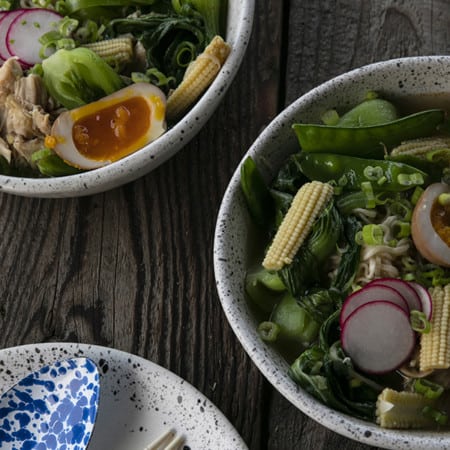 Instant Pot Chicken Ramen with jammy egg, baby corn, pea pods, bok choy, mushrooms, and radishes.