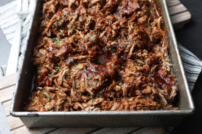 Today’s slow cooker recipe for Jack Daniels Pulled Pork is my go-to; it’s a reliable, easy recipe for the best pulled pork ever. Budget-friendly succulent pork shoulder slow cooks in Jack Daniels forming an irresistible whiskey bbq sauce. I mean honestly. How could this be anything less than sublime?