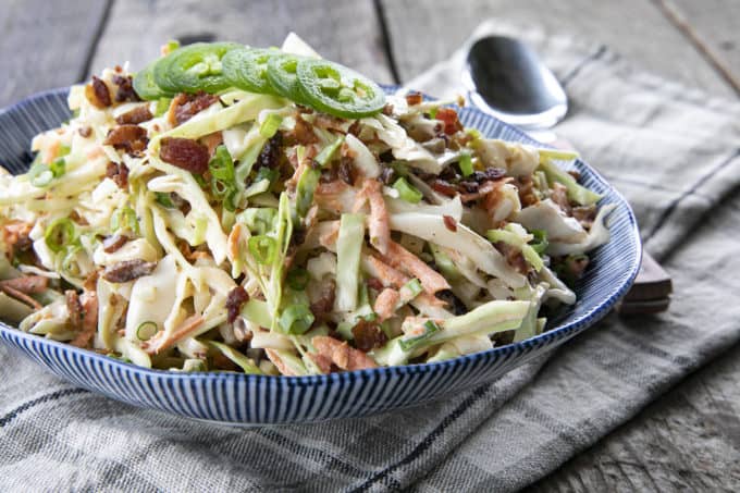 Jalapeno Coleslaw is a deliciously fresh, crunchy, savoury, summery salad to accompany all your grilled main dishes. Creamy, tangy, and easily adjustable to suit your heat-preferences, this super fresh spicy coleslaw is one you'll reach for again and again.