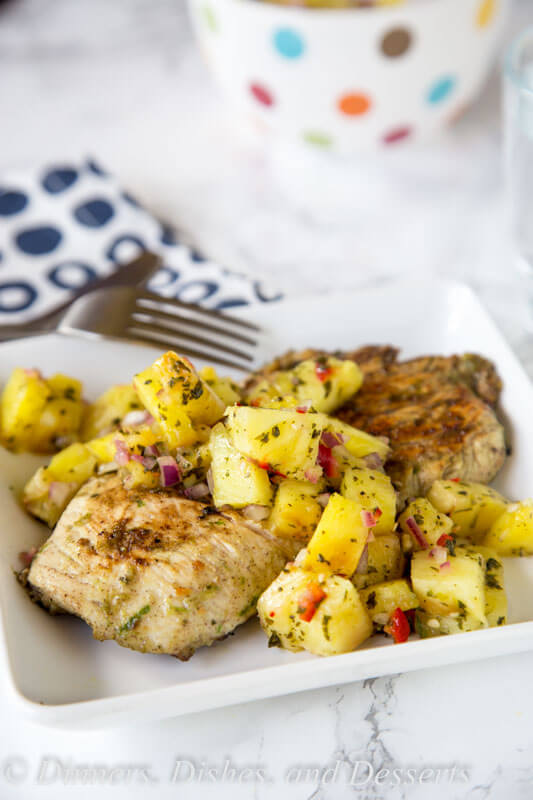 Jerk Chicken with Pineapple Salsa - a spicy and sweet grilled chicken recipe that comes together quickly. You will be craving the Tall, Dark & Delicious ice cream cake to cool down for dessert.