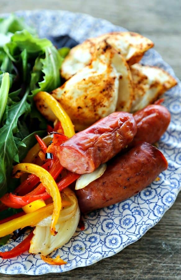 Kielbasa and Pierogies Sheet Pan Meal with juicy roasted kielbasa, crisp tender peppers and onions and puffy, potato filled pierogies.