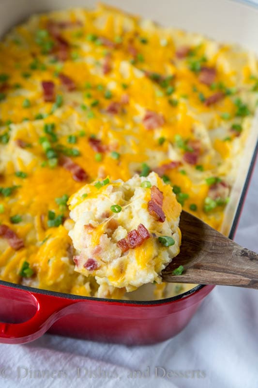 Loaded Twice Baked Potato Casserole - Turn twice baked potatoes into an easy cheesy potato casserole that will be sure to please. Loaded with garlic, cheese, and bacon!