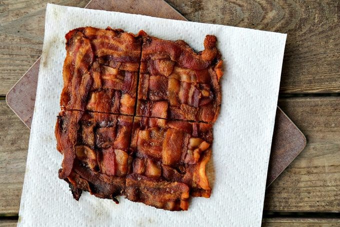 This Low-Carb Bacon Bun Swiss Burger is still seriously indulgent with a basket-weave bacon bun, melted Swiss cheese, a ground chuck burger, a hint of Dijon mustard, leaf lettuce, fresh tomato, and sweet onion. Hang onto that last bit of summer!