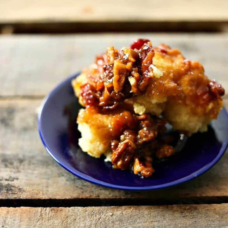 Tender buttermilk biscuits on maple brown sugar bacon caramel with pecans from foodiewithfamily.com