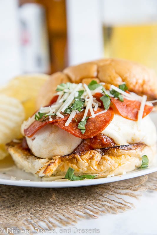 Pepperoni Pizza Burger - Combine 2 favorites with this easy burger recipe. Sausage and beef make up the burger, top with pizza sauce, cheese, and pepperoni for an epic burger night!