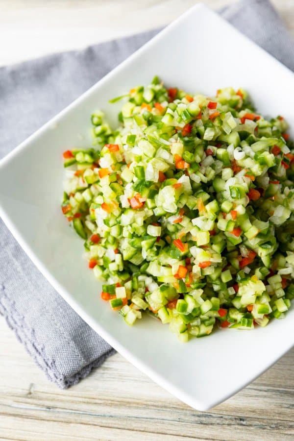 Pickle de Gallo combines everything you love about garlicky dill pickles with the crunch of fresh cucumbers, red bell peppers, and onions, and the snackability of pico de gallo or salsa. It's about to be your new favourite thing.