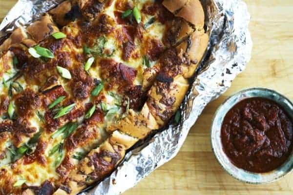 Pizza Party Bread: ooey, gooey, melted mozzarella and crispy pepperoni on buttery garlic bread that is made to be torn apart and shared by friends.