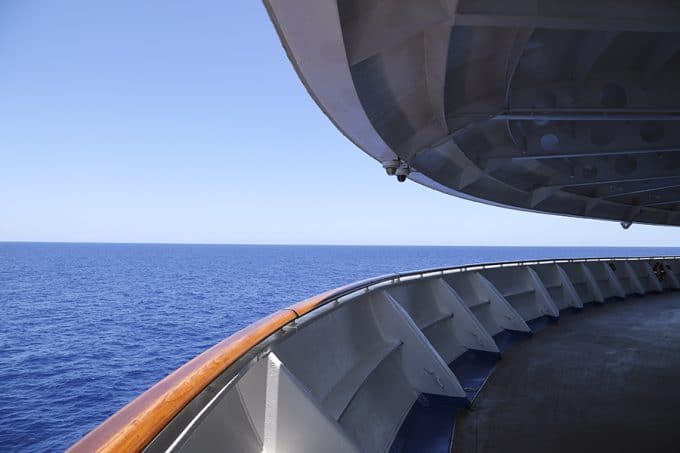 On the forward deck of the Caribbean Princess with Princess Cruises.