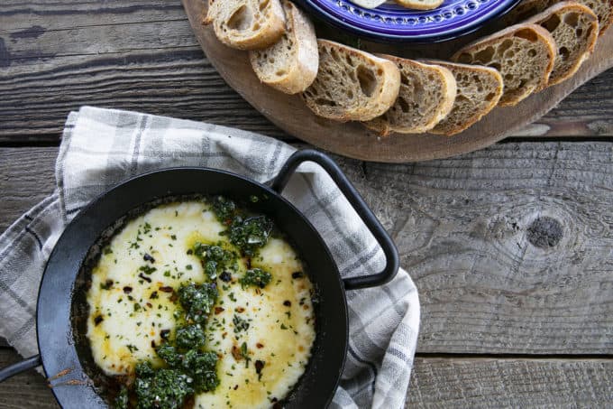 Provoleta -or Fried Cheese- is a delicious Argentinian cheese dish of pan-fried provolone cheese with crushed red pepper flakes and delicious garlic and herb chimichurri. An easier and more enticing appetizer simply doesn't exist!