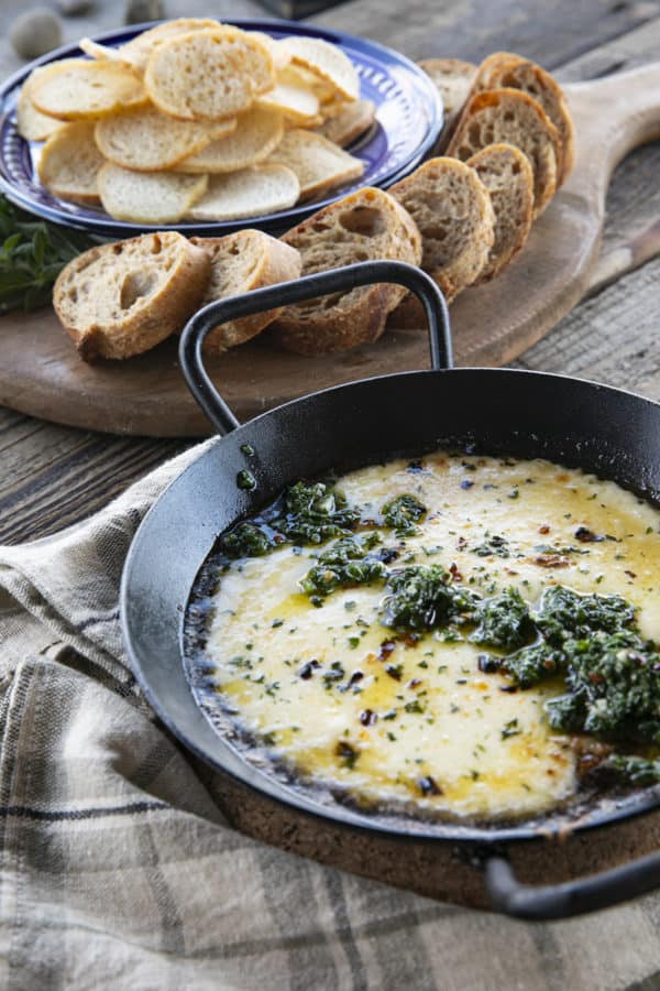 Provoleta -or Fried Cheese- is a delicious Argentinian cheese dish of pan-fried provolone cheese with crushed red pepper flakes and delicious garlic and herb chimichurri. An easier and more enticing appetizer simply doesn't exist!