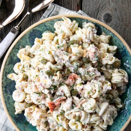 Smoked Salmon Pasta Salad is about to become your new favourite pasta salad. Savoury smoked salmon, a simple creamy dill dressing, hard-boiled eggs, capers, and red onions combine to amp up pasta salad to a whole new level. You'll find yourself craving this!