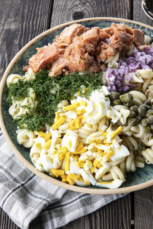 Smoked Salmon Pasta Salad is about to become your new favourite pasta salad. Savoury smoked salmon, a simple creamy dill dressing, hard-boiled eggs, capers, and red onions combine to amp up pasta salad to a whole new level. You'll find yourself craving this!