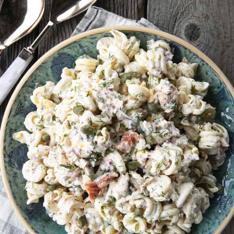 Smoked Salmon Pasta Salad is about to become your new favourite pasta salad. Savoury smoked salmon, a simple creamy dill dressing, hard-boiled eggs, capers, and red onions combine to amp up pasta salad to a whole new level. You'll find yourself craving this!