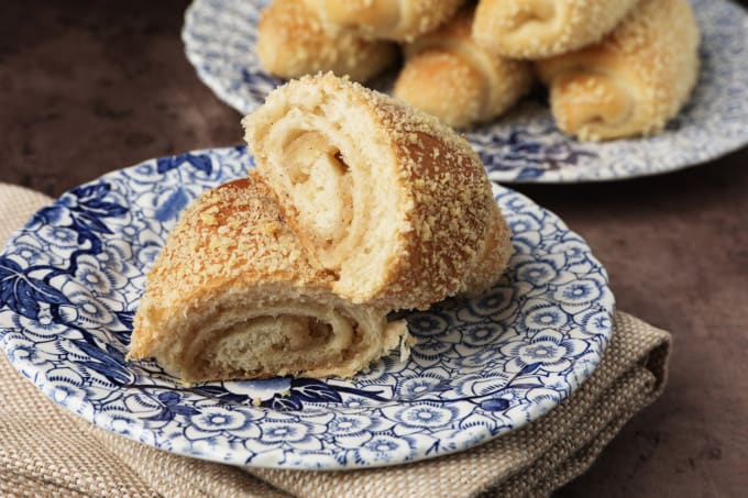 Tender milk bread, a swirl of mildly cinnamon scented caramel-like filling, and a topping of crispy crumbs all combine to make Senorita Bread; a classic Filipino popular afternoon snack that's beloved by all ages. There's nothing quite like a Señorita roll with your cup of coffee, tea, or even dipped into cold milk. Filipino cuisine is a delicious amalgam of the many cultures that have impacted the Philippines over its history whether through trade, conquest, or political influence. It's impossible to cover all of these within the confines of a little blog post about a delicious bread roll with sweet buttery filling.