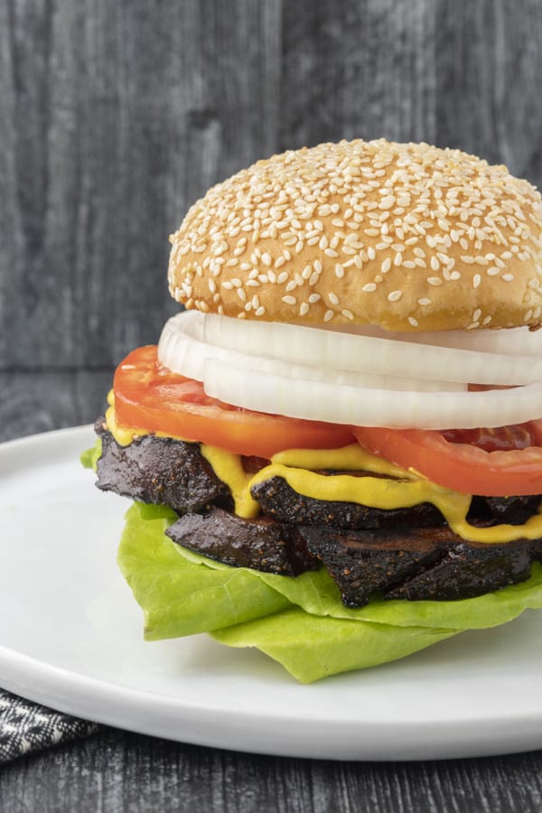 crispy-edged bologna on a hamburger bun or great homemade sandwich bread with mustard or mayo, lettuce, tomato, and a slab of sweet onion.