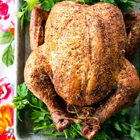 You will never believe how easy and spectacular this smoked whole chicken recipe is until you try it yourself. Full of tips and tricks, this post will help you make the best smoked chicken recipe you've ever had in your life!