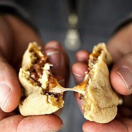 Gooey, Snickers Stuffed Peanut Butter Cookies #cookies foodiewithfamily.com