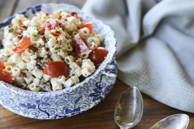 Tender, little ditalini, crunchy yellow and orange bell pepper, cucumber, crispy bacon crumbles, tiny cubes of Cheddar and pepper jack cheese, and minced fresh jalapeño pepper and chives in a creamy ranch dressing make this Spicy Bacon Cheddar Pasta Salad recipe scream summer!