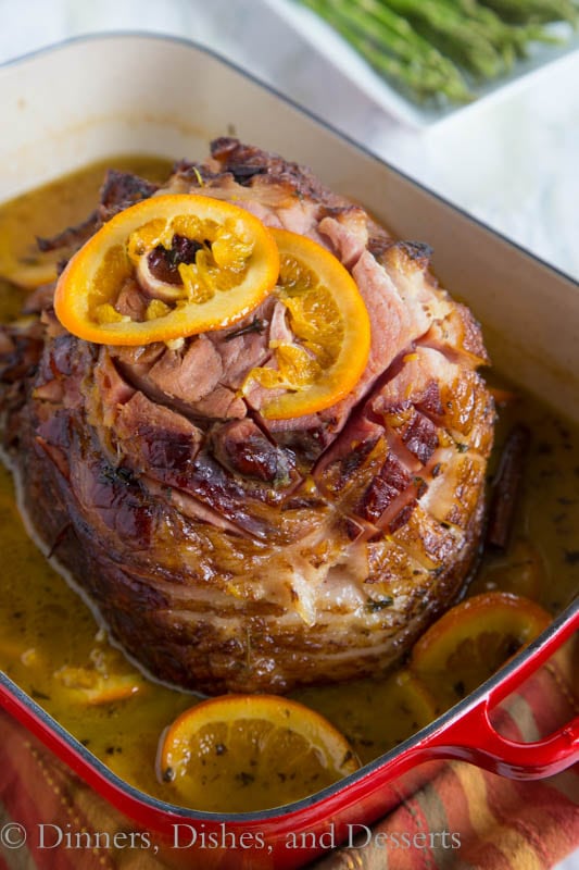 Tangerine Glazed Ham - a delicious baked ham with a sweet tangerine glaze. Perfect for any holiday table.