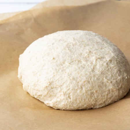 This whole wheat pizza dough yields our family's favourite pizza crust; crispy and chewy, flavourful crust that holds up to anything you put on it.