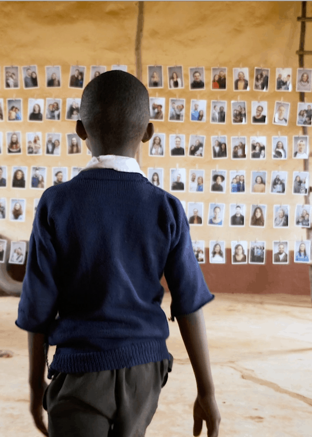 A Child looking at potential sponsors to choose through World Vision's Chosen program.